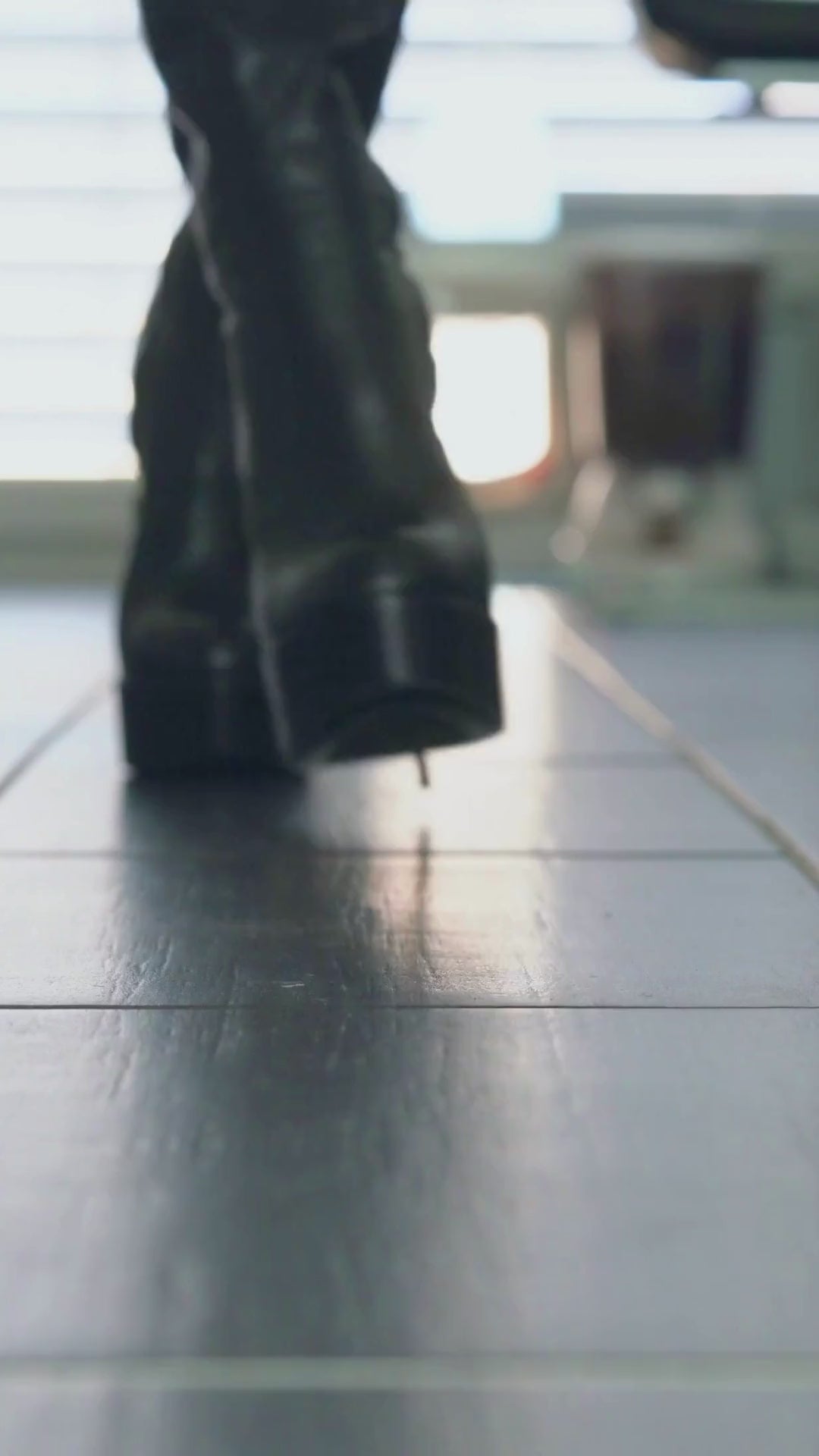 Load video: Black stiletto boots walking video showcasing heel and fit